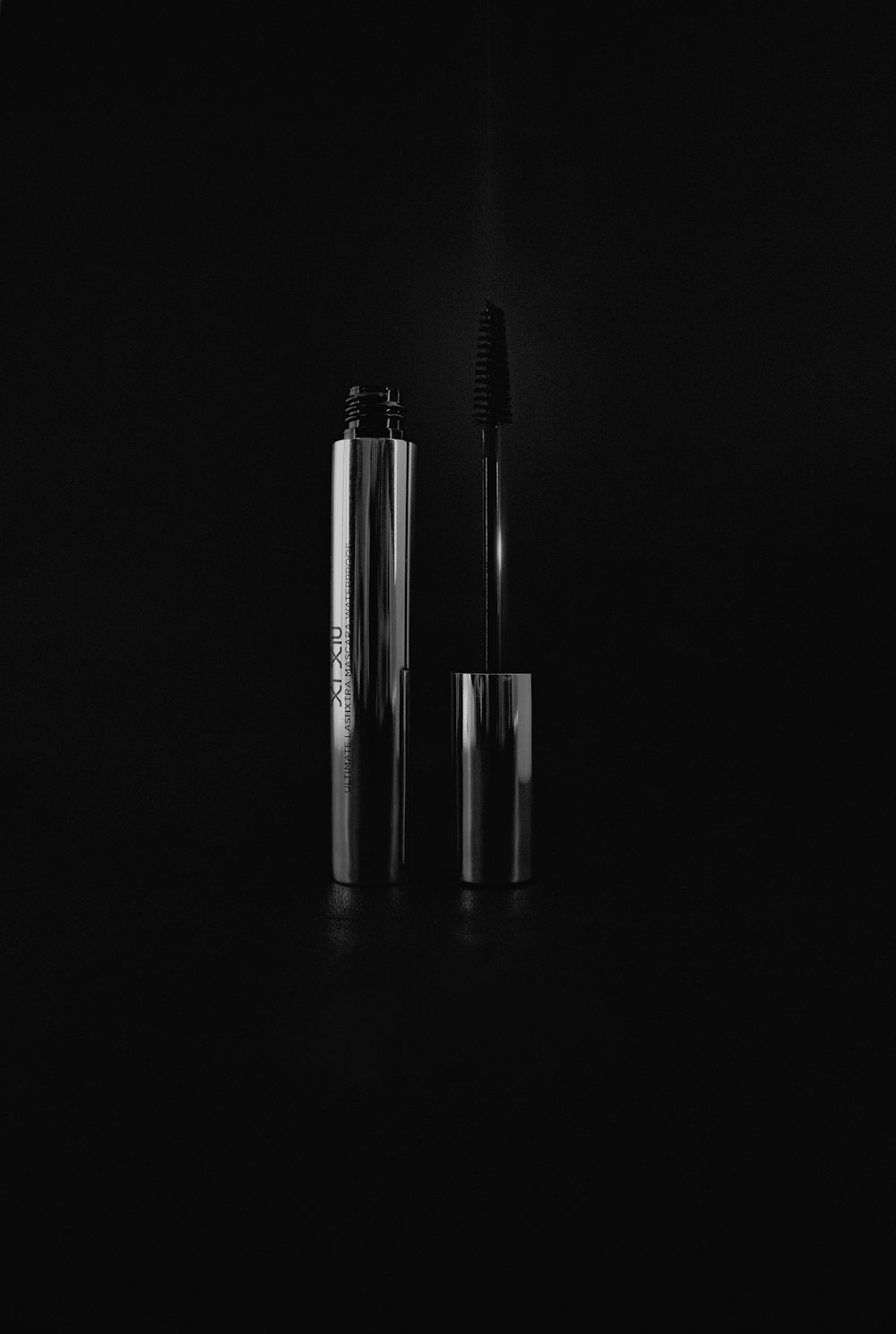 a black and white photo of a pair of mascaras