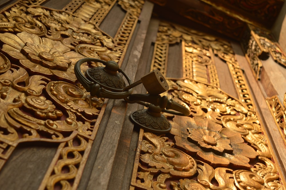 a close up of a decorative wooden door