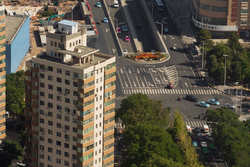 an aerial view of a city street with a traffic intersection