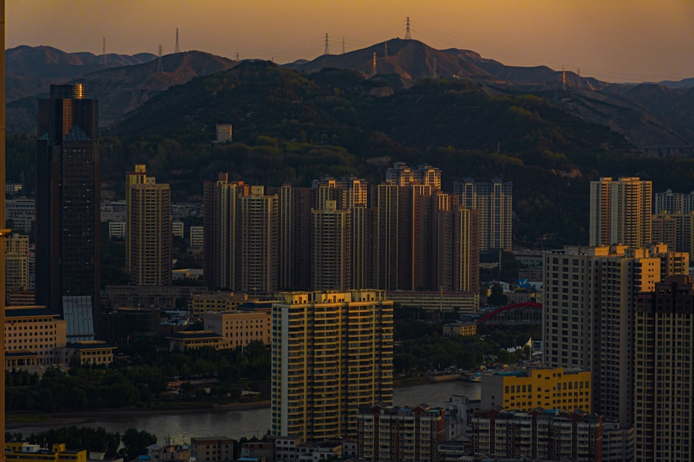 a view of a city with mountains in the background