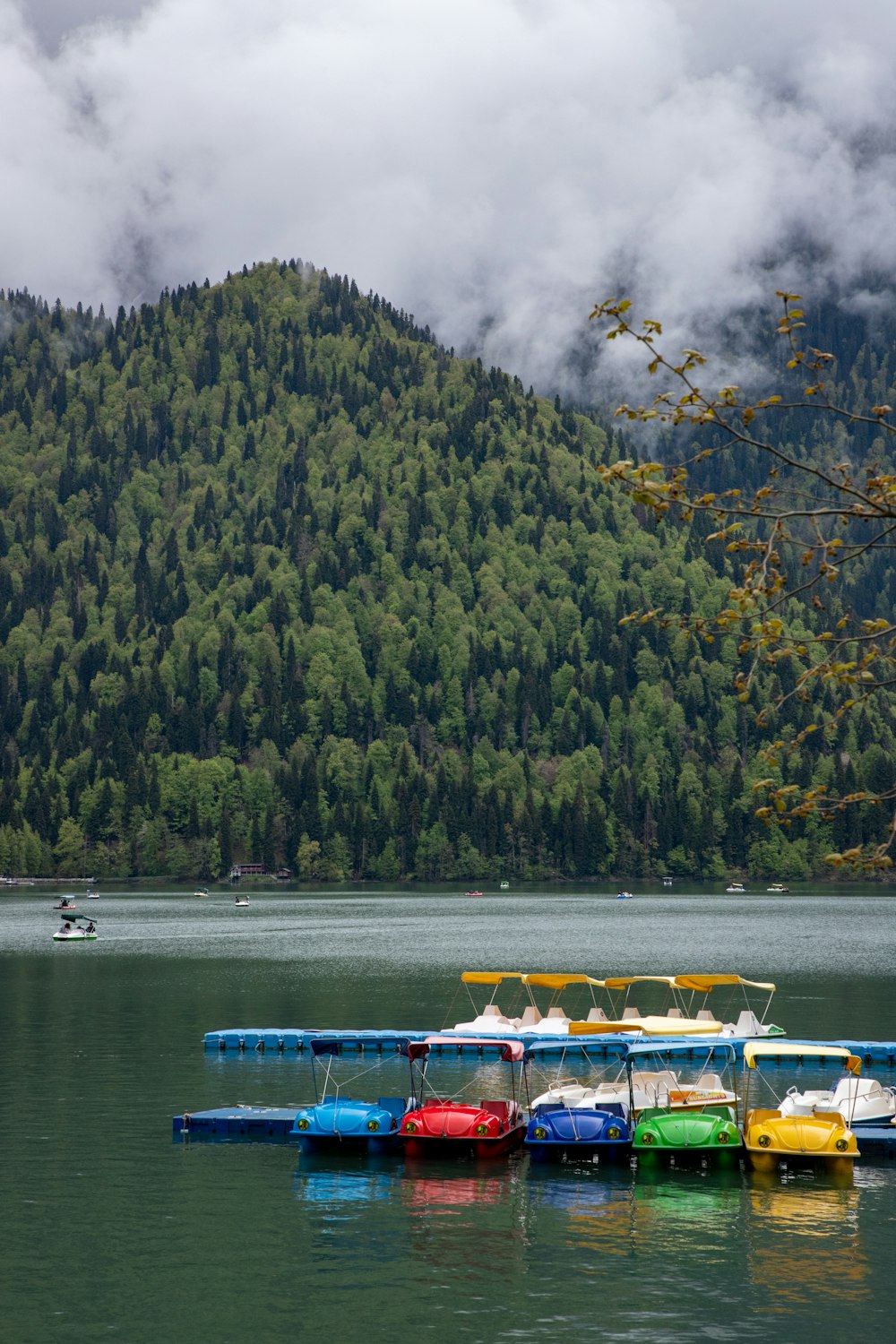 a group of boats that are sitting in the water