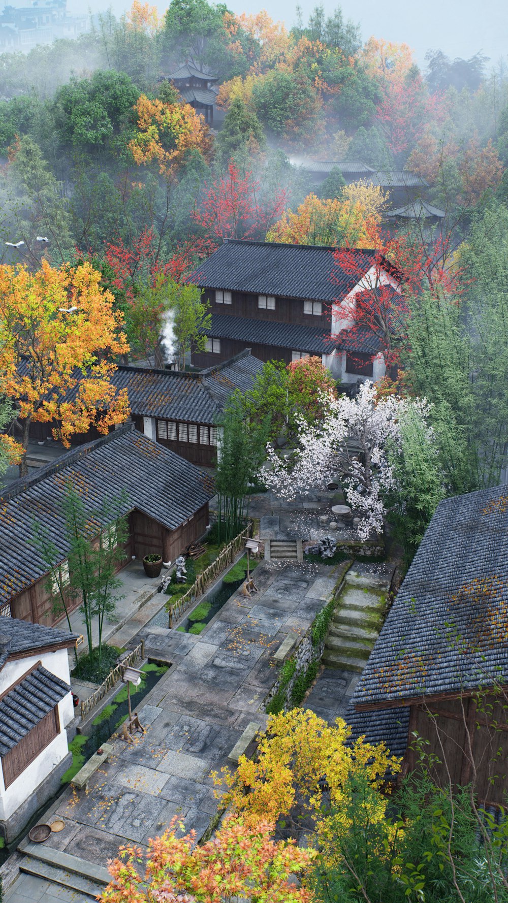 an aerial view of a village in autumn