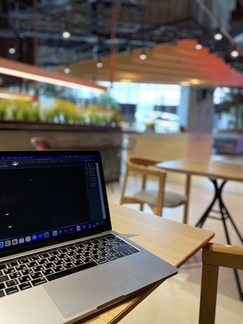 A modern workspace with a laptop and product samples on the table.