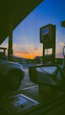 Fuel pumps at Gasolinera Bacum station during sunset.