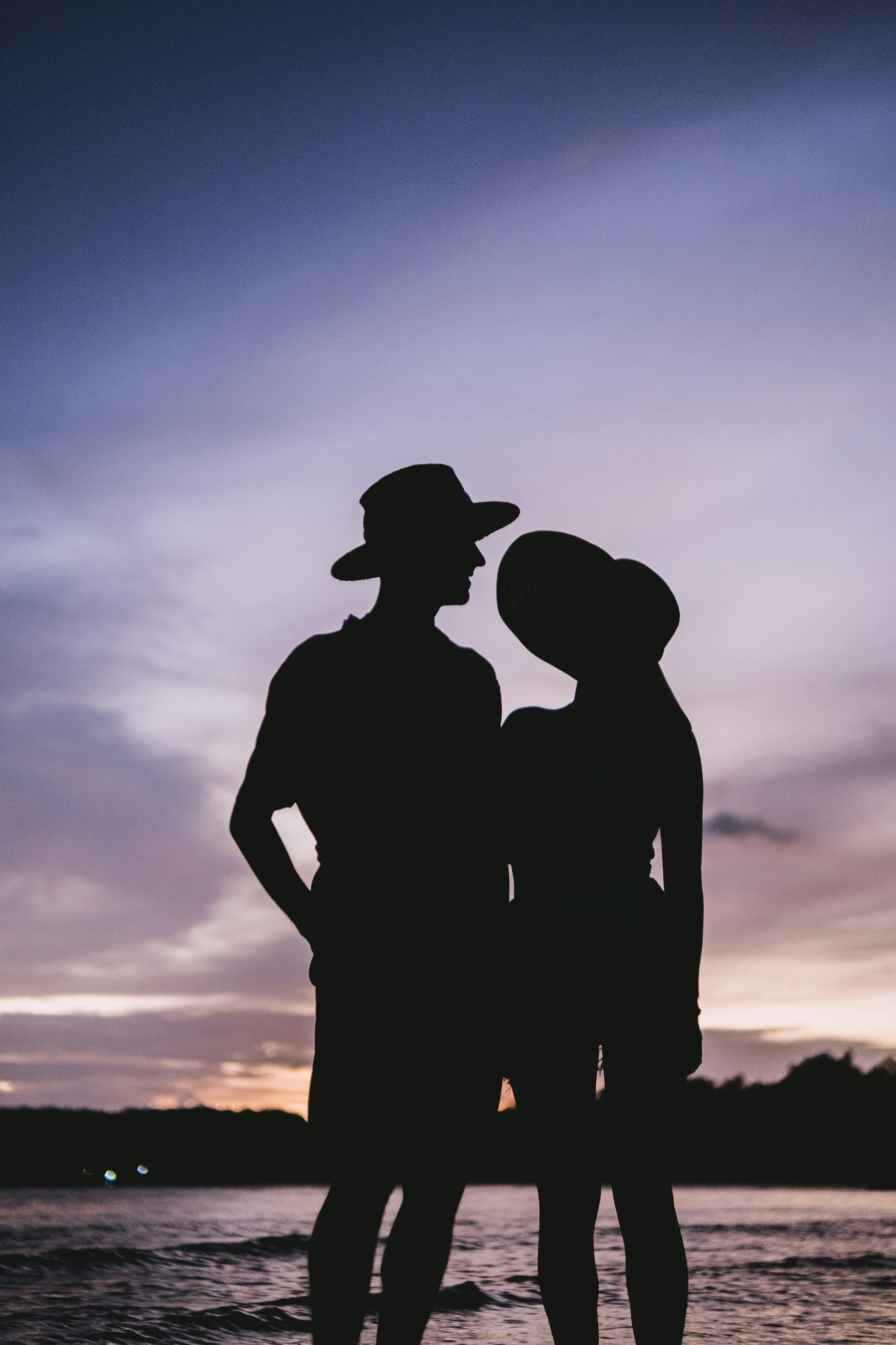 a couple of people standing next to each other