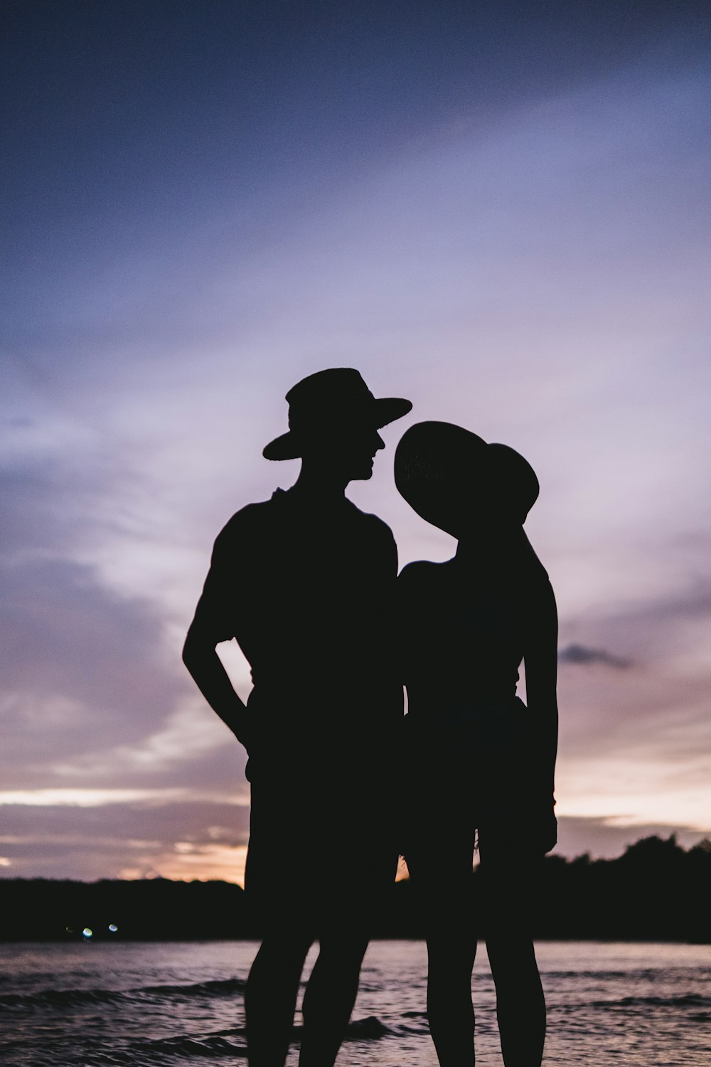 a couple of people standing next to each other