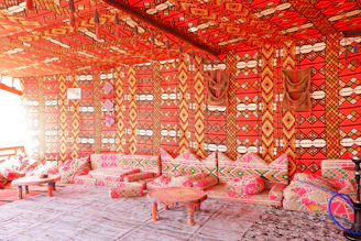 Warm and inviting Moroccan living room with traditional textiles and earth-toned walls.