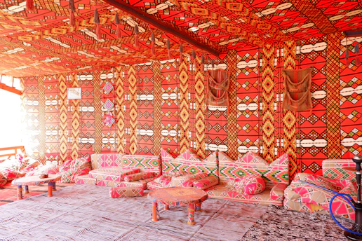 Close-up of a beautifully styled Moroccan room with warm terracotta and gold tones.