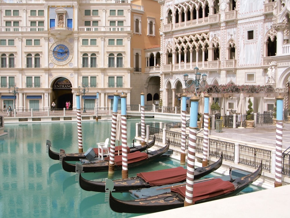 a row of gondolas sitting next to a building