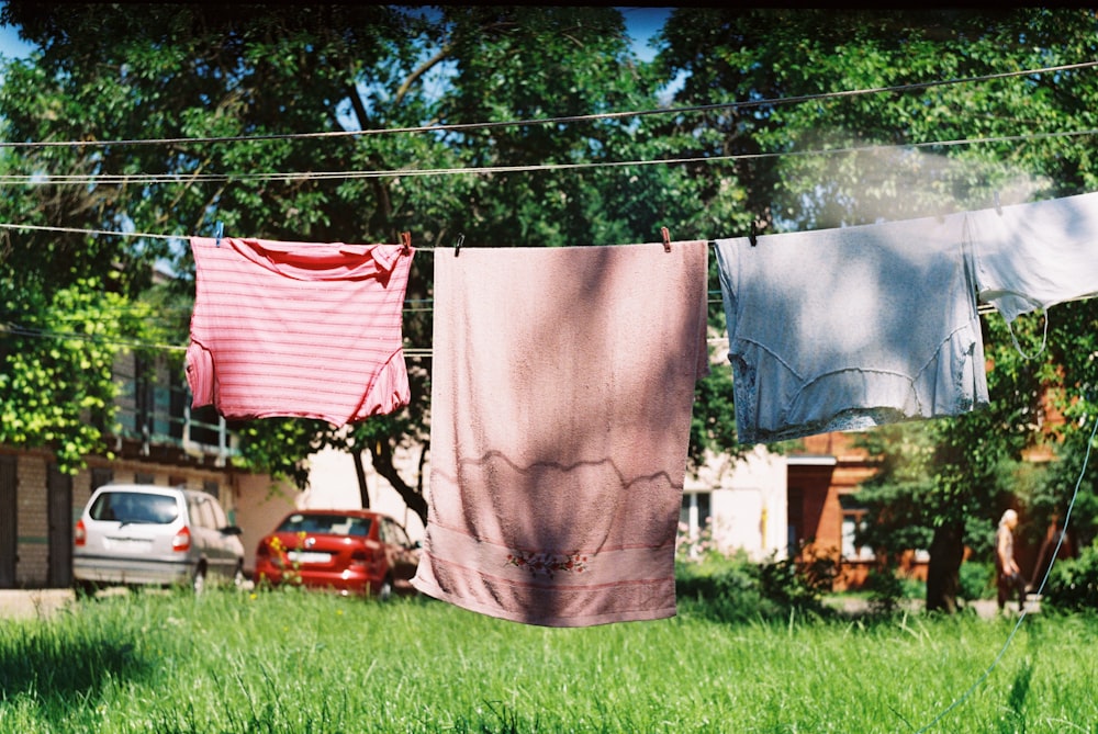 clothes hanging on a clothes line in a yard