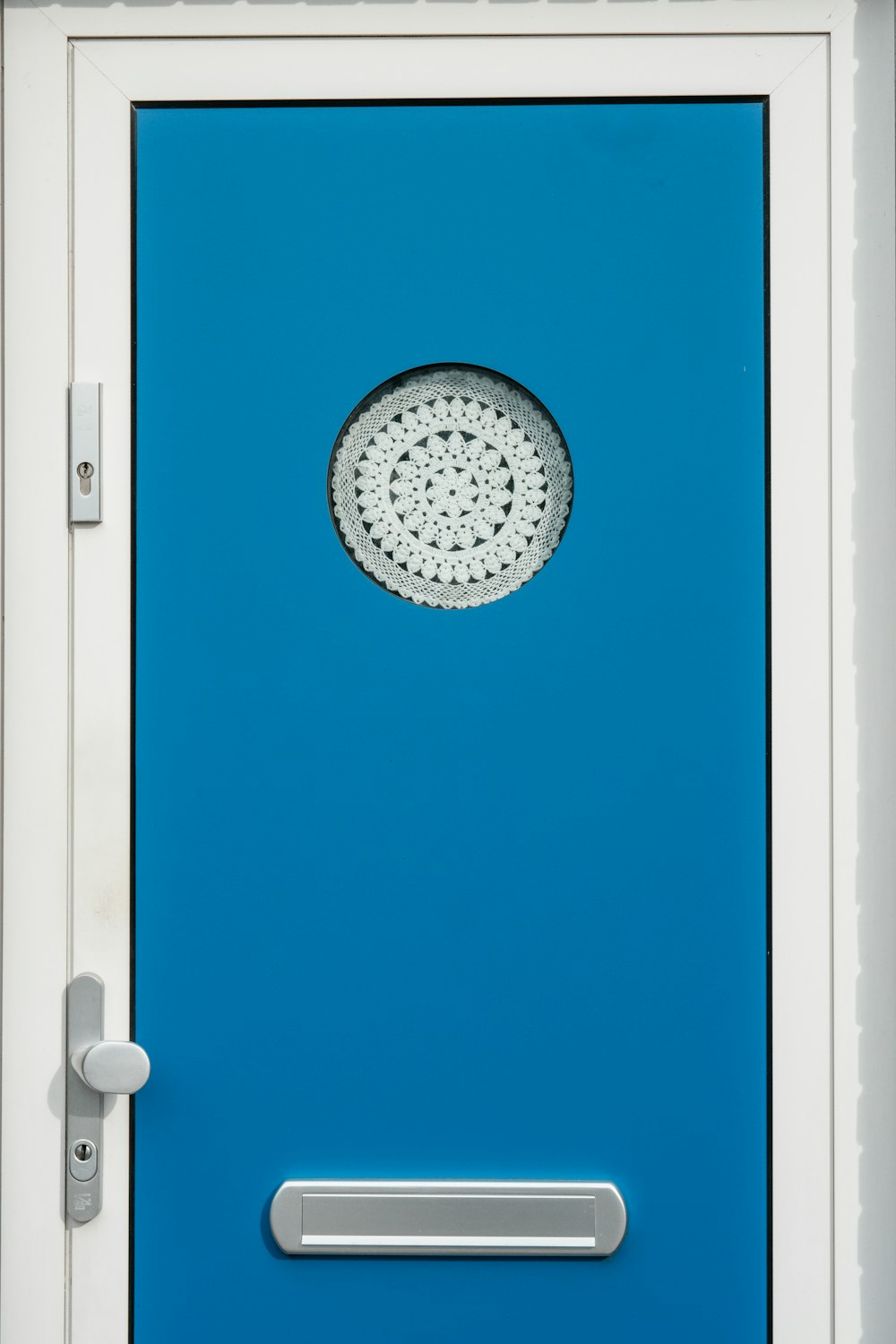 a blue door with a shower head on it