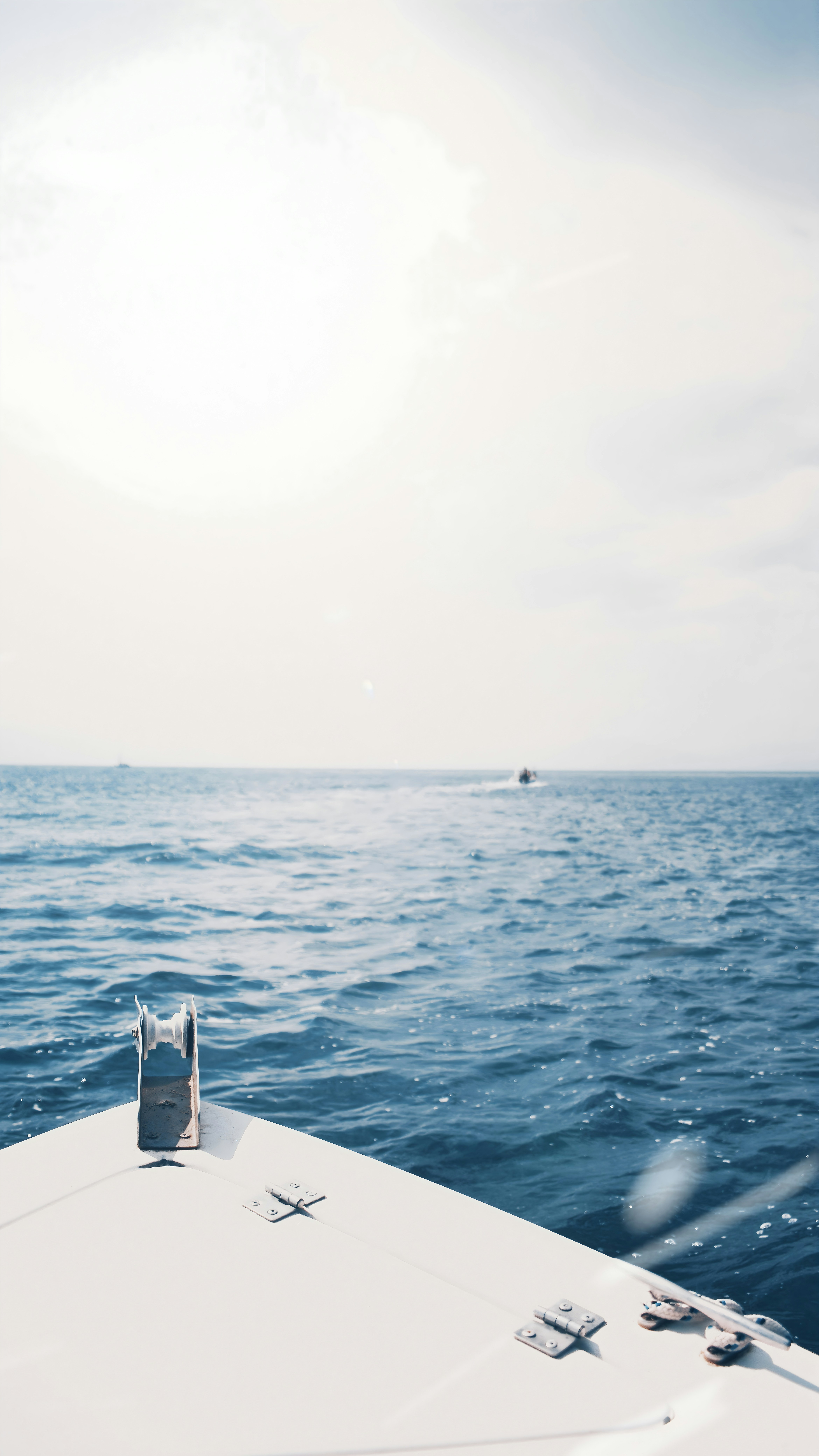 a bag sitting on top of a boat in the ocean