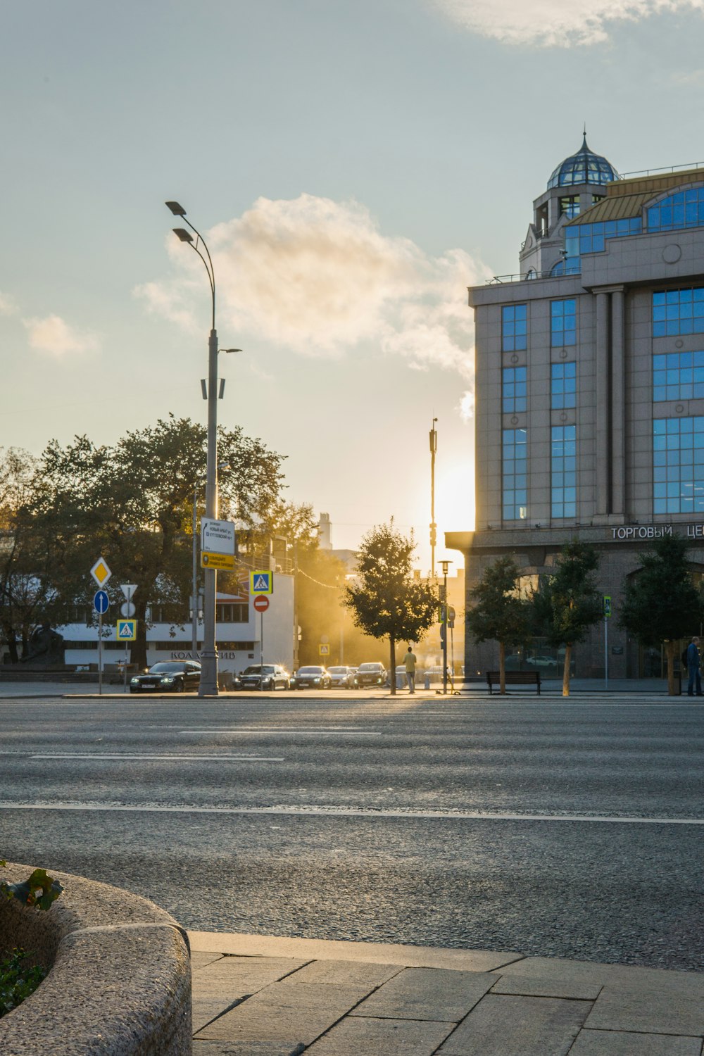 a city street with a building in the background