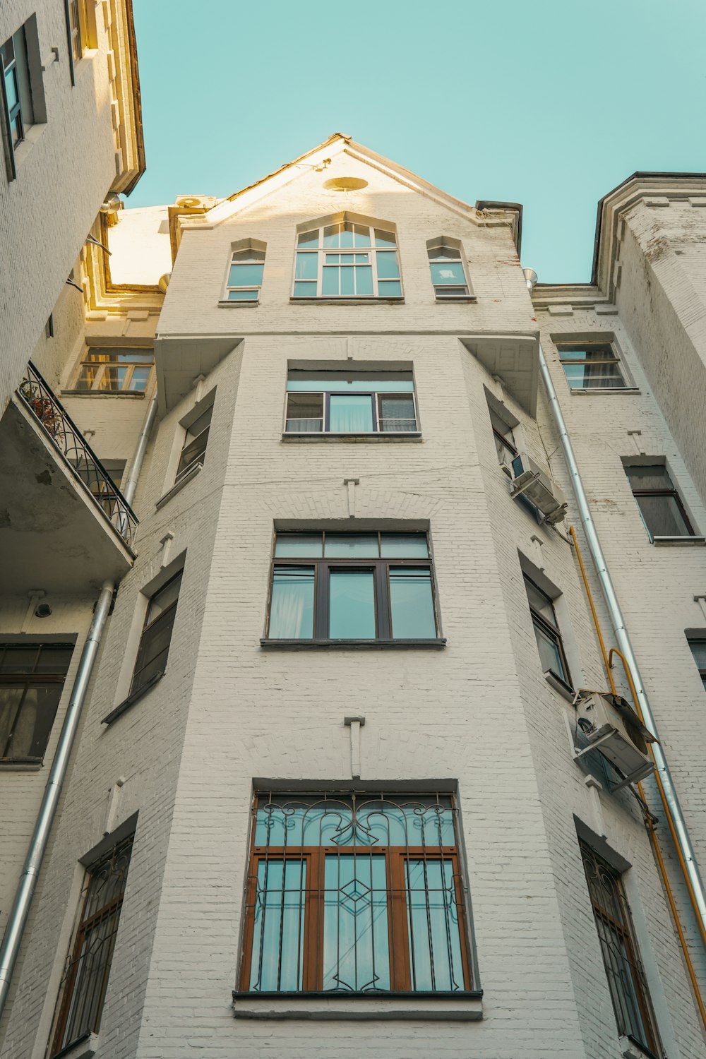 a tall white building with lots of windows