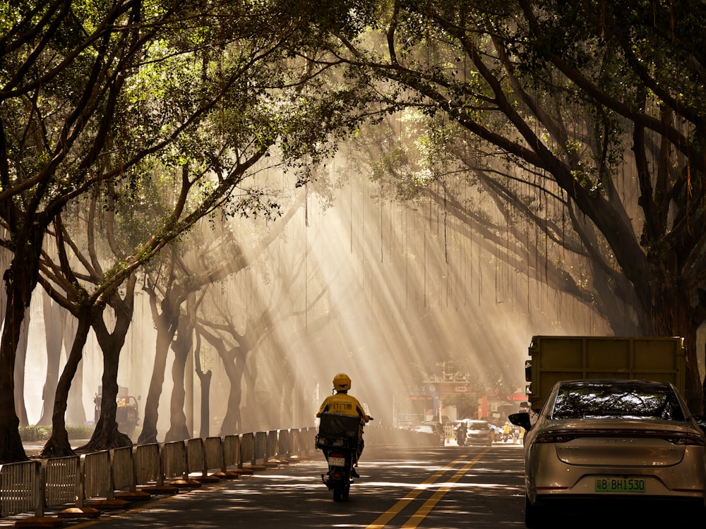 a person riding a motorcycle down a street