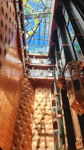 Close-up of a beautifully finished ceiling with textured wall and copper accent lighting in a modern interior.