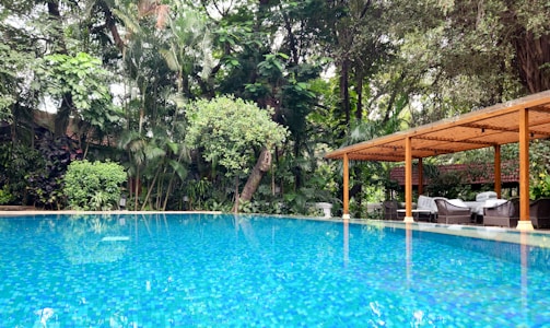 The private pool surrounded by lush greenery.