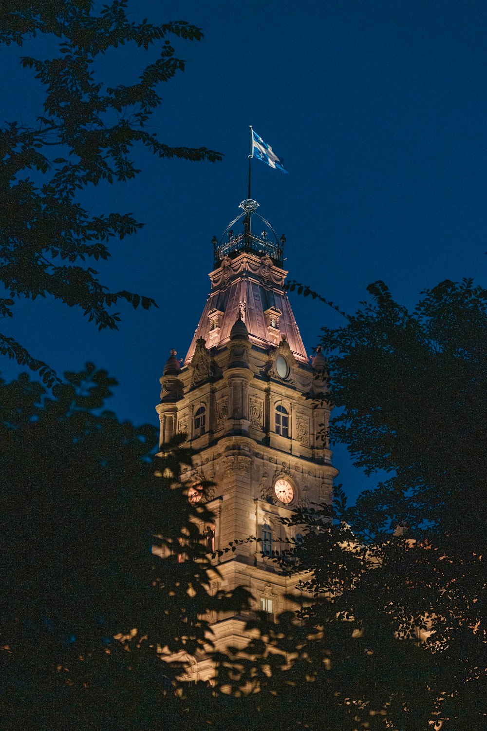 a tall tower with a flag on top of it