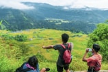 A group of travelers enjoying a scenic mountain view in Java during a Bamboo Tour trip.