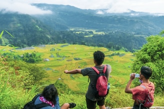 Tourists enjoying a scenic view from a jeep overlooking Sidemen valley.
