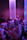Happy group enjoying a well-organized social event with elegant purple lighting accents