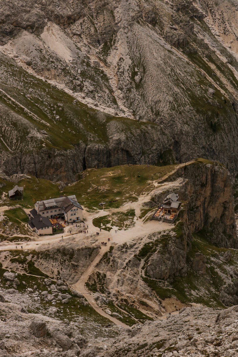 a small house on a rocky mountain side