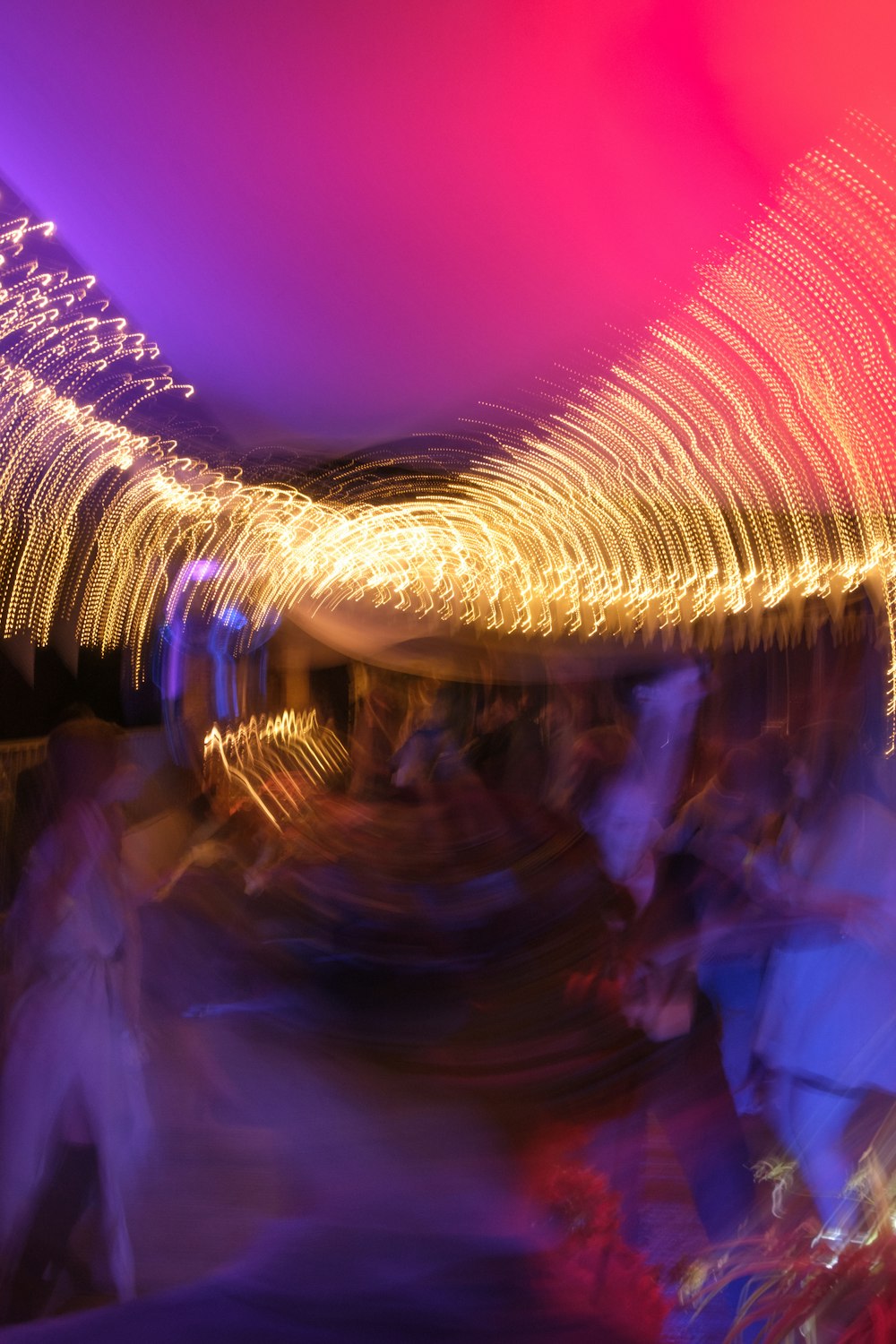 a blurry photo of a group of people dancing