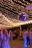 Photo of a lively outdoor party with guests enjoying the basketball trailer under bright party lights.