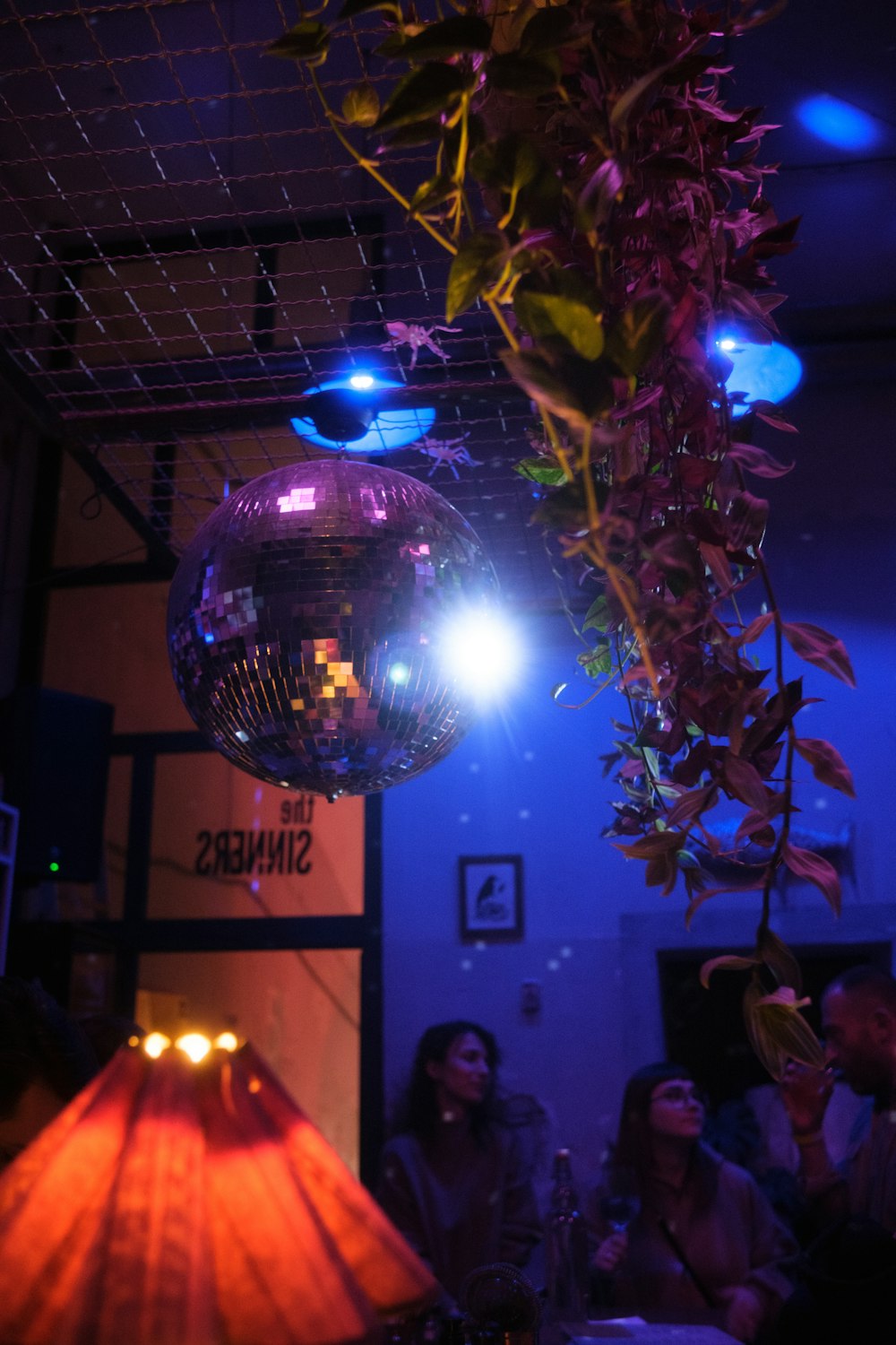 a disco ball hanging from a ceiling in a room