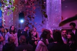 a group of people standing around in a room