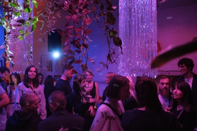 a group of people standing around in a room