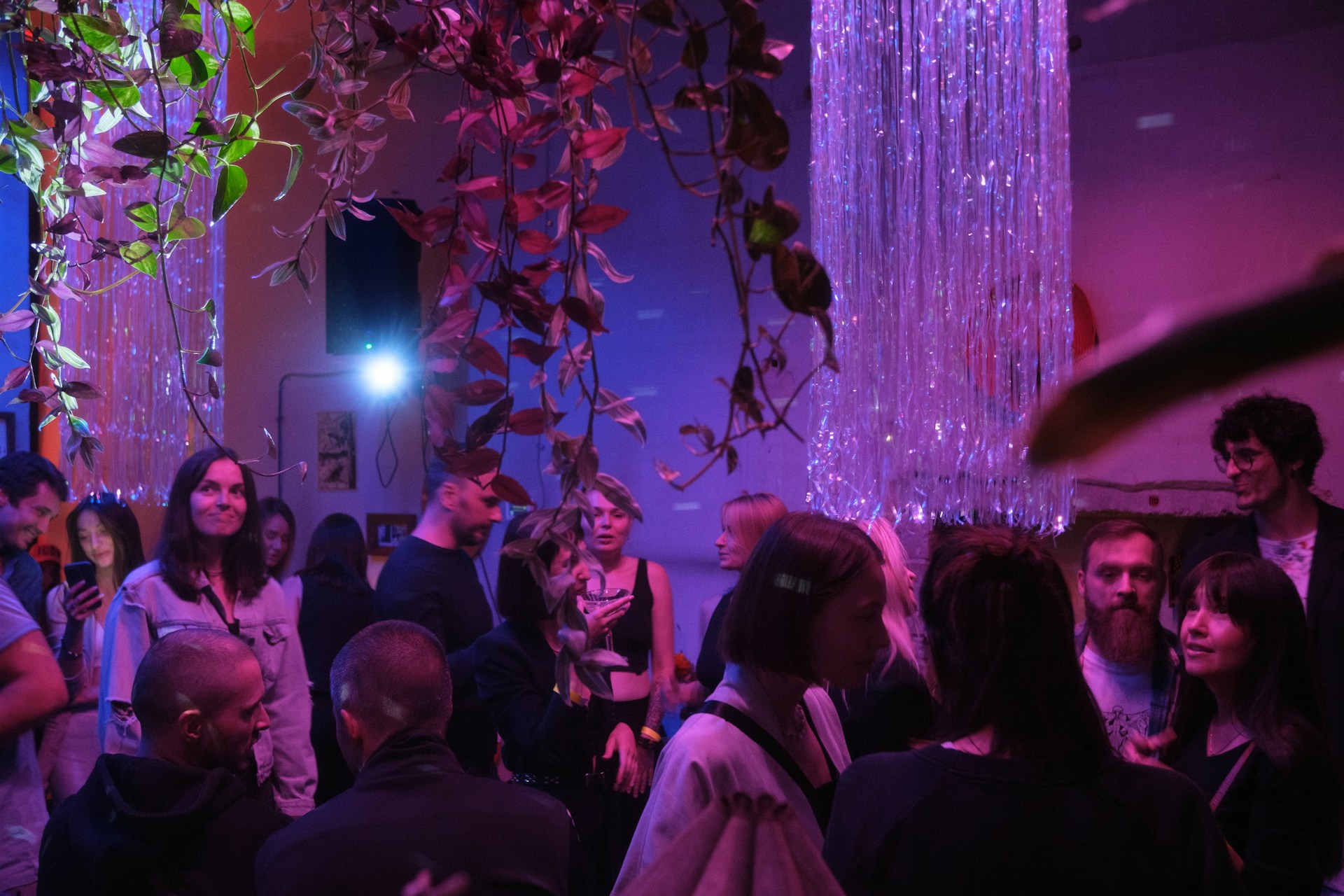 a group of people standing around in a room