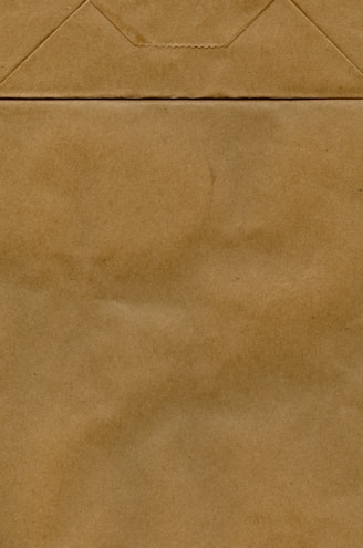 a piece of brown paper that has been folded