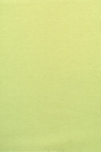 A plain textile surface with a uniform light green color and visible stitching along the bottom edge.