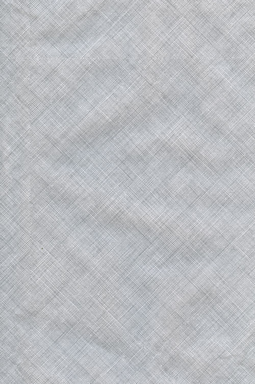 a light blue fabric textured with a diagonal pattern