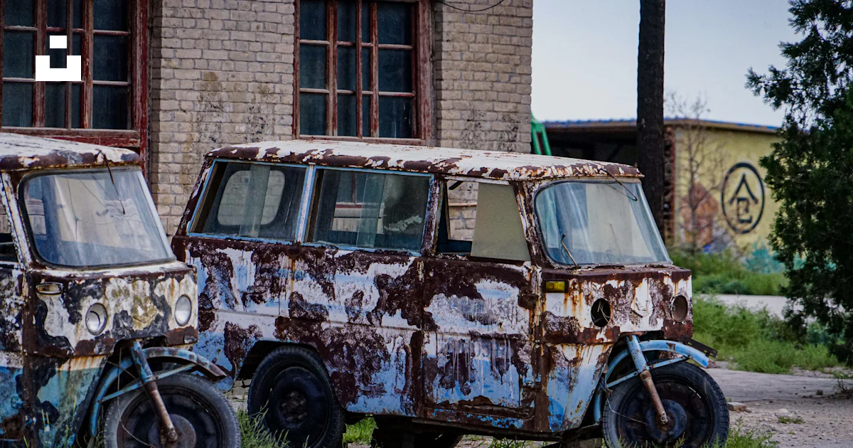 Old Rusted Vans Two old rusted out vans sitting in a field photo – Free 镇北堡西部影城 Image ...
