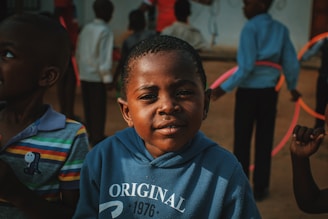 a group of young boys standing next to each other
