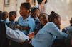 a group of young girls sitting next to each other