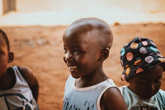 a group of young children standing next to each other