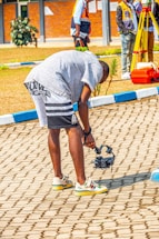 Technician inspecting a residential drain system with fiber-optic camera.