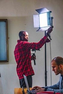 Team member manually adjusting ad settings on a laptop.