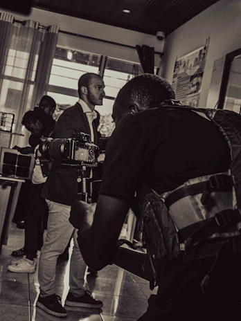 A professional photographer capturing the moment of profile compilation for an honorary doctorate recipient.