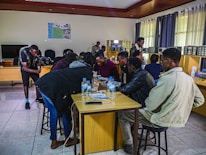 A group of diverse people collaborating on a sustainable water technology project.