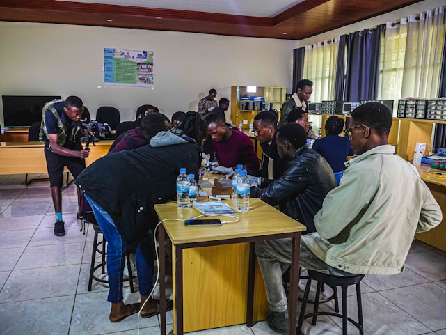 A lively group of engineers and students collaborating during a workshop in Guntur