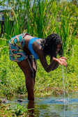 Outdoor session showing participants collecting water samples from a local source.
