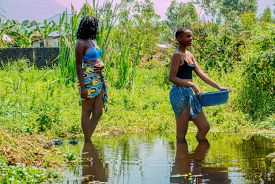 Women learning water conservation techniques in a rural field.