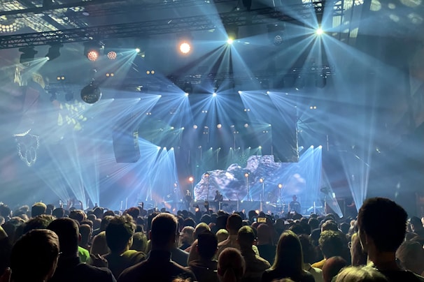 An audience enjoying a spectacular light show during a concert.