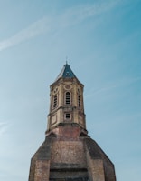 The historic Markka watch tower standing tall against a clear blue sky.