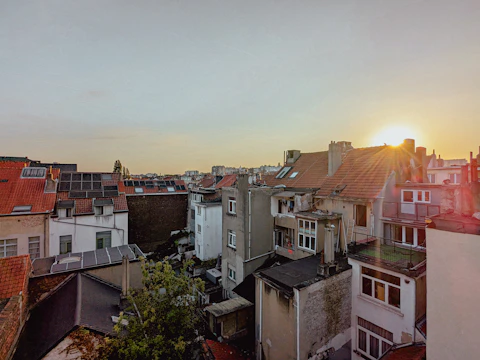 Wide shot of a Cádiz neighborhood with multiple homes featuring solar installations.