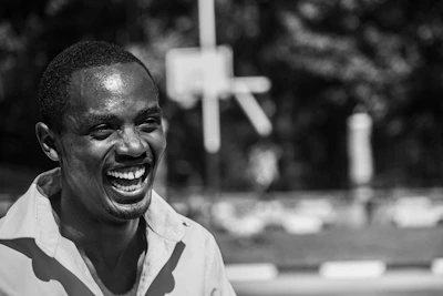 A vibrant portrait of a smiling athlete mid-action, capturing the energy and focus of sports photography.